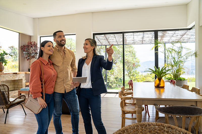 Real estate agent showing a house