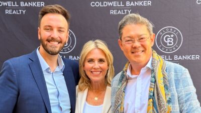 Christophe Choo with Coldwell Banker leadership at Beverly Hills awards event holding top agent certificate