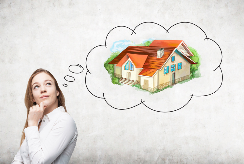 a woman thinking about her ideal luxury home