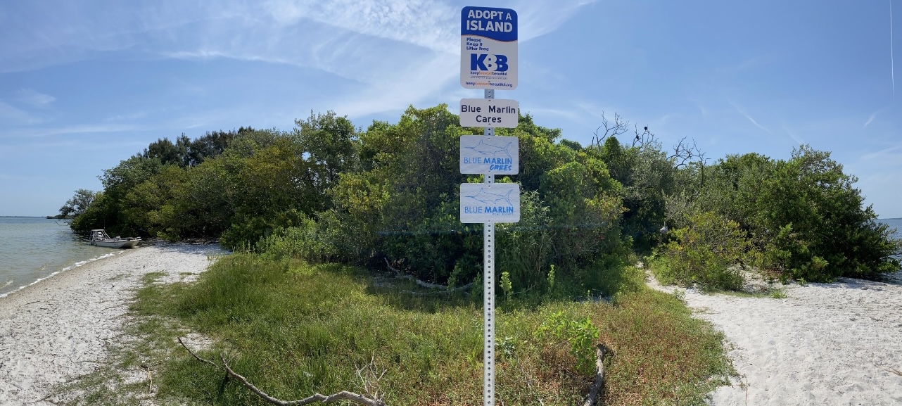Blue Marlin Real Estate BMRE Cares Keep Brevard Beautiful sign at Bird Island Banana River Merritt Island