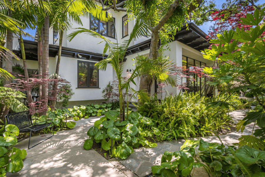 Tropical inspired landscaping of gated home