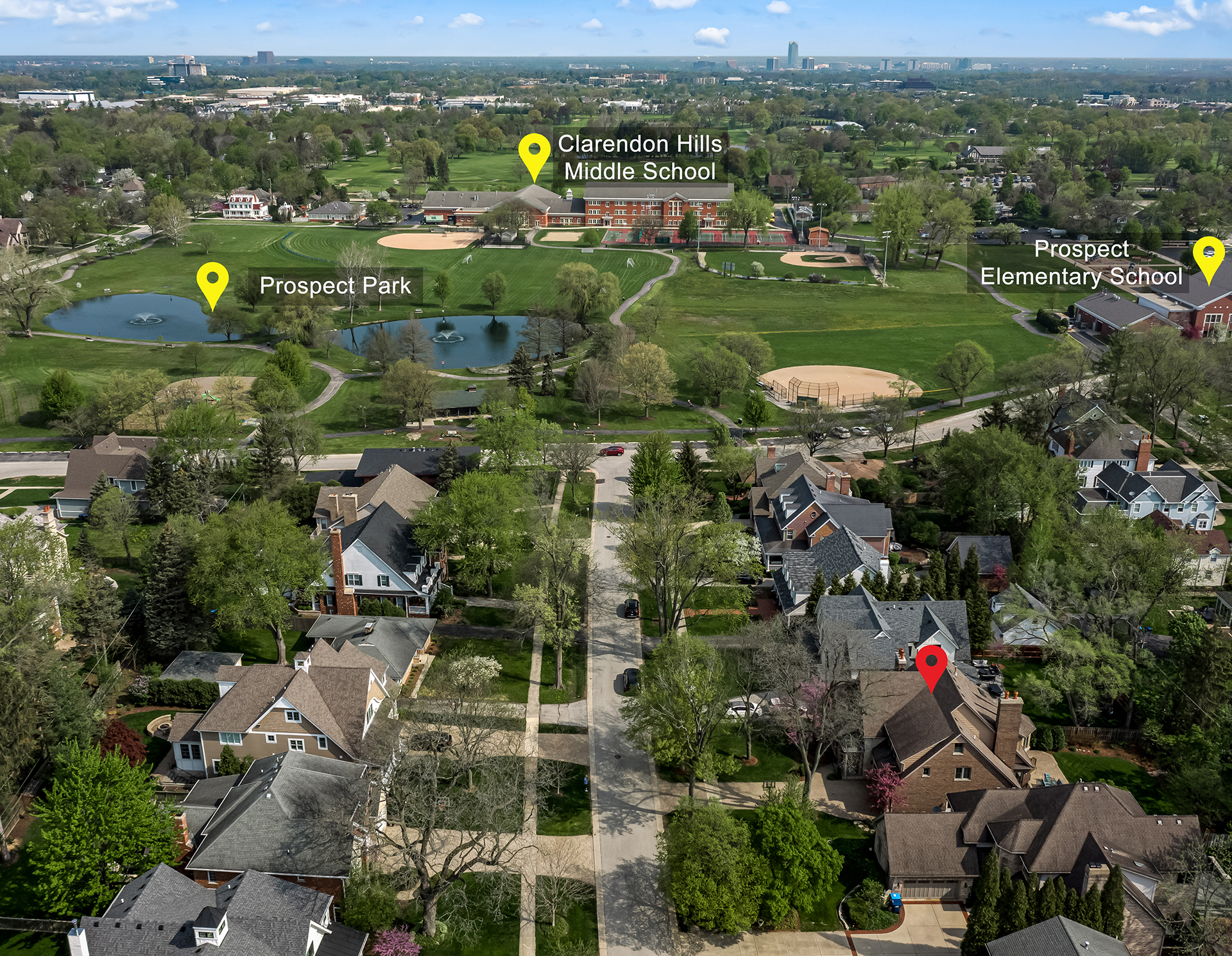 Luxury homes walk to park and school on a tree-lined street in Clarendon Hills, Illinois, showcasing high-end architecture, walkability and curb appeal