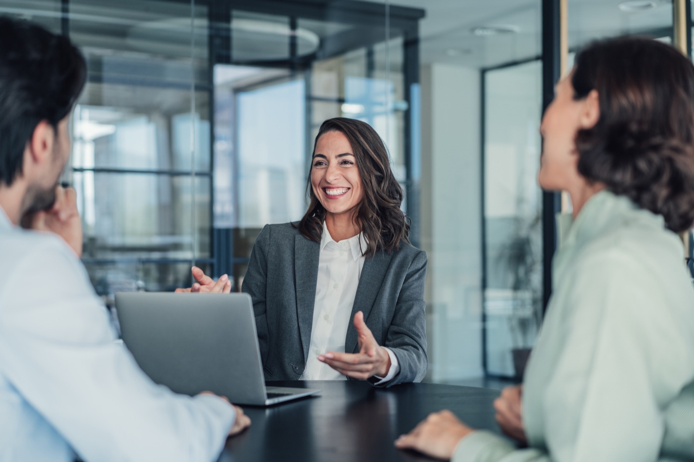 Agent meeting with a client at a laptop