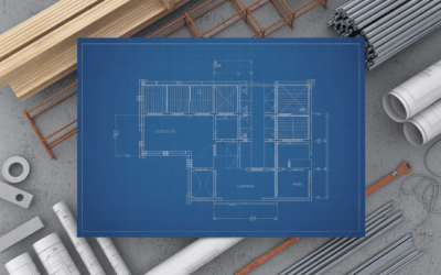 Luxury home under construction with crane and workers, showcasing high-end residential project.