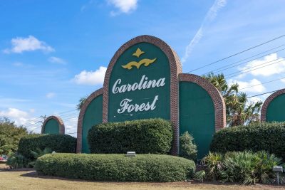 Carolina Forest entrance sign in the Myrtle Beach area, a community known for its variety of neighborhoods, amenities, and convenient location.