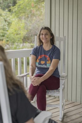 Mary Childress, Conway SC Realtor, sitting on a porch talking with a client
