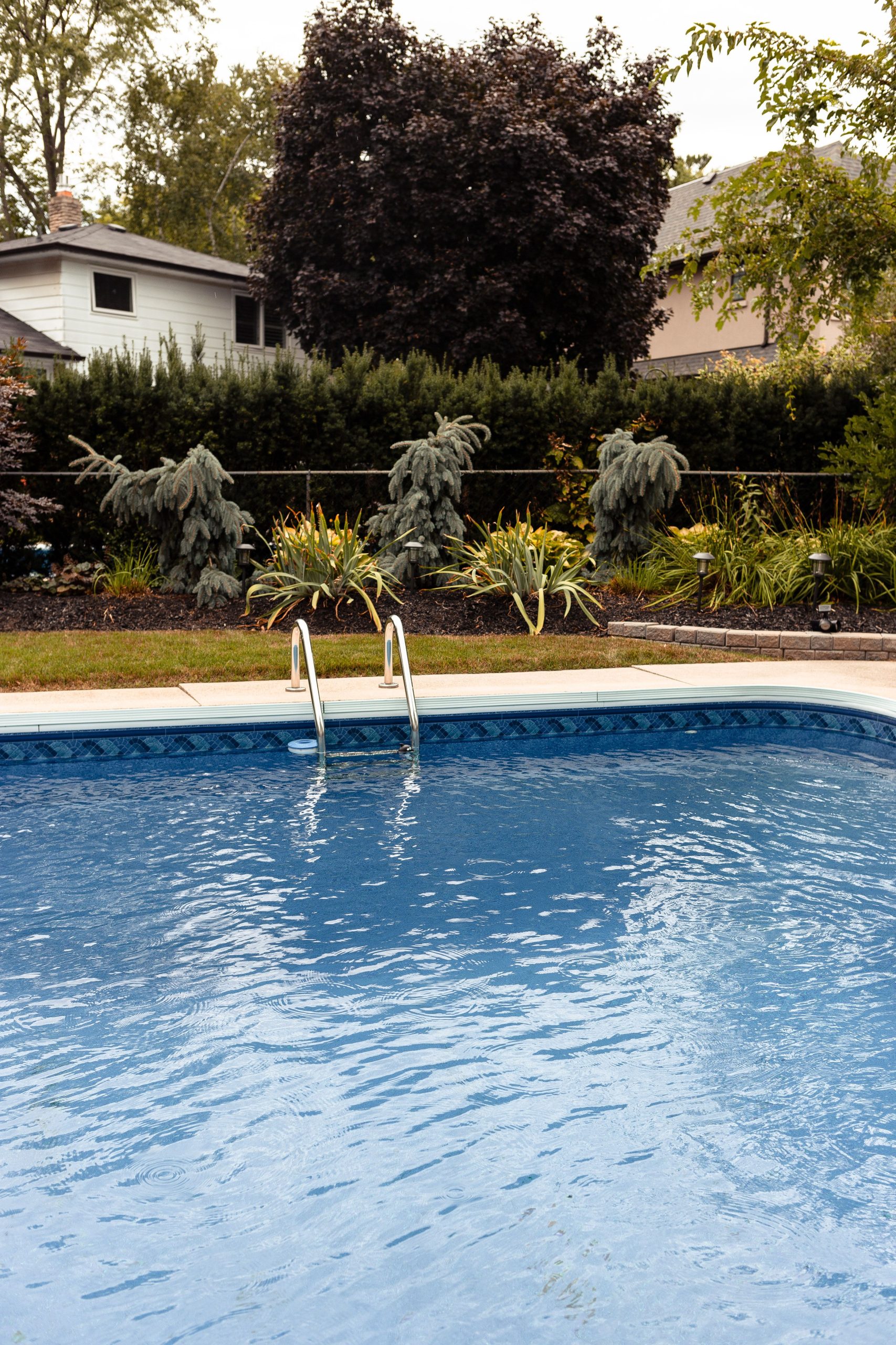 In-ground backyard swimming pool, a feature that may influence a home's appeal and market value.