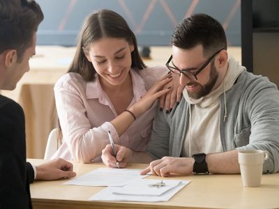 Couple Sign Purchase Contract