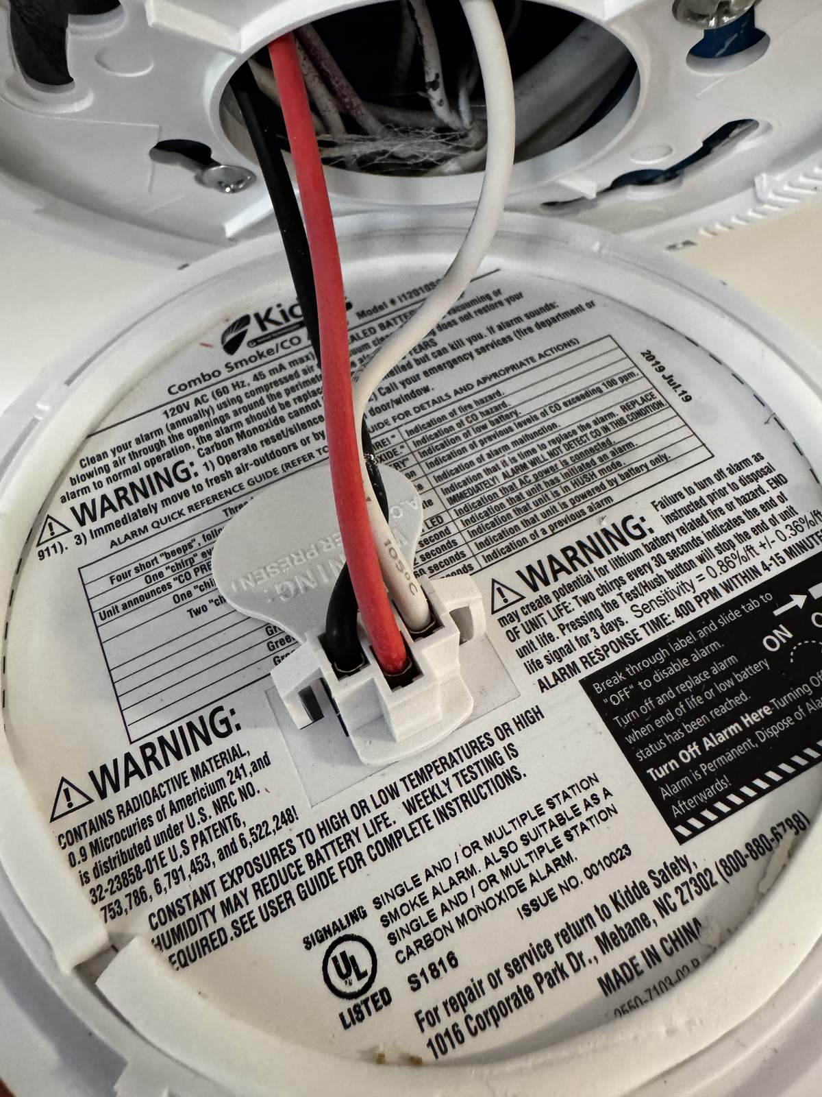 Smoke and carbon monoxide alarm being checked before a Wellesley smoke inspection