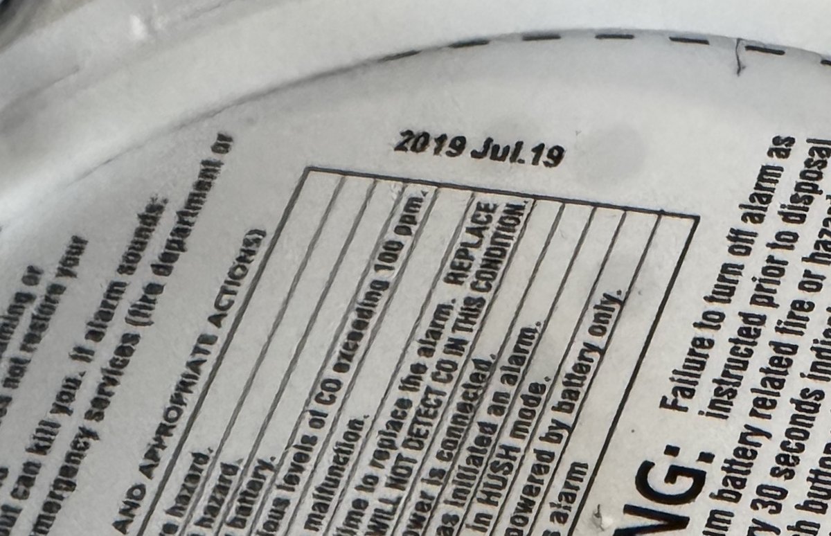 Reading the manufacture date on the back of a smoke alarm, the most common Wellesley smoke inspection failure