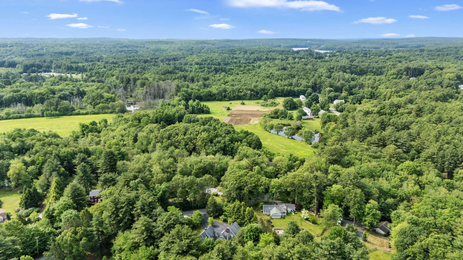 Conservation land and open fields surrounding Hopkinton Massachusetts neighborhoods