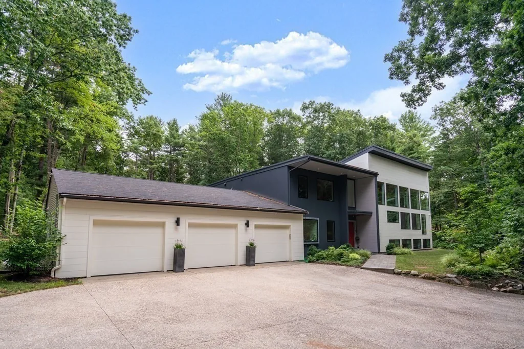 Contemporary Weston home on a wooded private lot