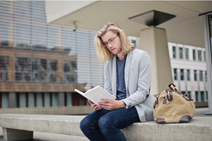 College Student Reading a Book