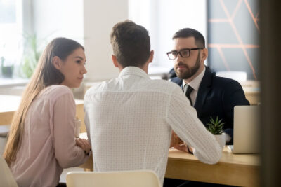 two men and a woman having an interview