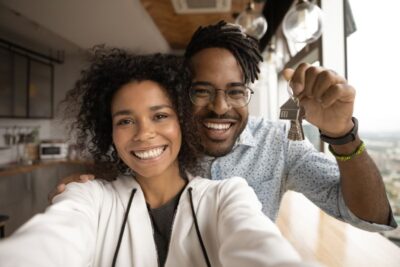 head shot portrait overjoyed african american couple showing keys