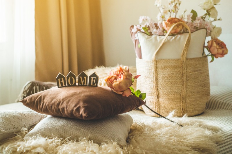 A lot of decorative cozy pillows and the inscription