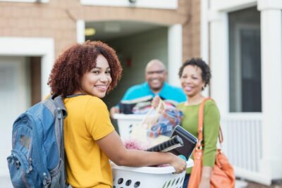 African-American parents helping daughter move