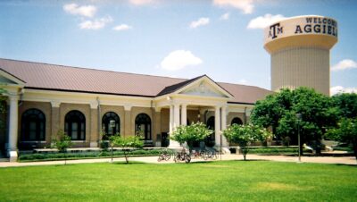 Campus grounds of Texas A&M, featuring a building and some lawn greens