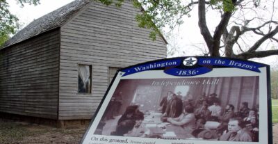 An educational sign pinpointing Washington-on-the-Brazos (also known as Washington), an unincorporated area along the Brazos River in Washington County, Texas, United States.