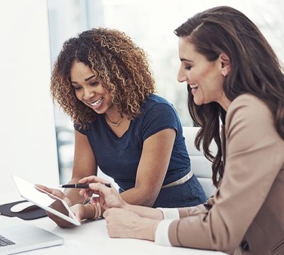 Prospective homebuyers reviewing available homes online before purchasing a Central Texas home