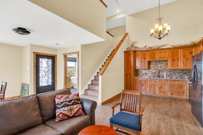 Texas Hill Country estate San Marcos TX RV garage apartment with kitchen, living area, and staircase at 761 Allison Lane with attached workshop garage