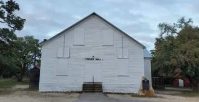Historic Fischer Dance Hall in Fischer Texas featuring classic white wooden exterior, a landmark of Hill Country history and community gatherings