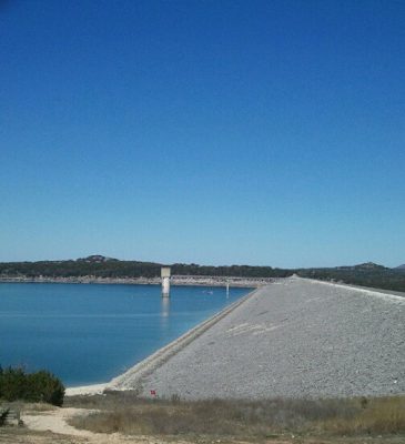 Canyon Lake Dam in Texas with expansive reservoir water and Hill Country landscape