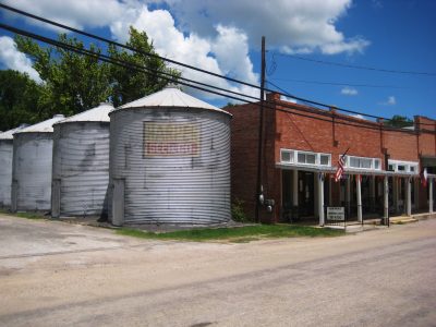 Downtown Martindale Texas featuring historic grain bins and Harper Seed Farm silos