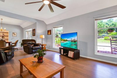 Spacious living room in Spring Lake Hills home with vaulted ceilings and natural light in San Marcos TX