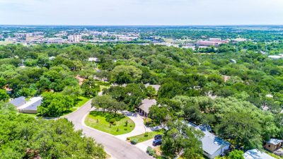 Hilltop aerial view of established residential area near downtown San Marcos and Texas State University