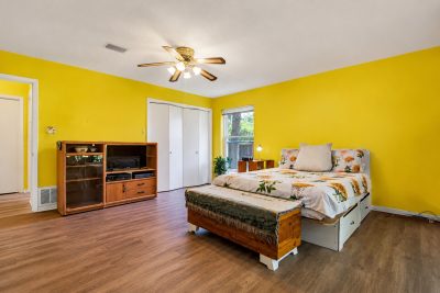 Oversized primary bedroom with large windows and natural light in established San Marcos home