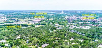 Aerial view of Texas State University, Spring Lake, and surrounding San Marcos neighborhoods in Central Texas