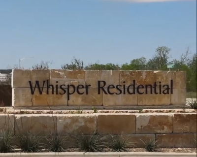 Whisper Subdivision entrance sign in San Marcos TX