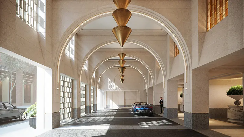 Grand arched porte-cochère entrance with soaring ceilings and geometric brass chandeliers arriving at waldorf astoria new york residences.