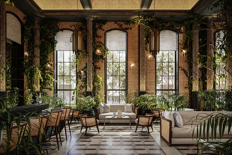 Sunlit botanical lounge with floor-to-ceiling arched windows, lush greenery, woven seating, and Art Deco detailing at Waldorf Astoria residences New York.