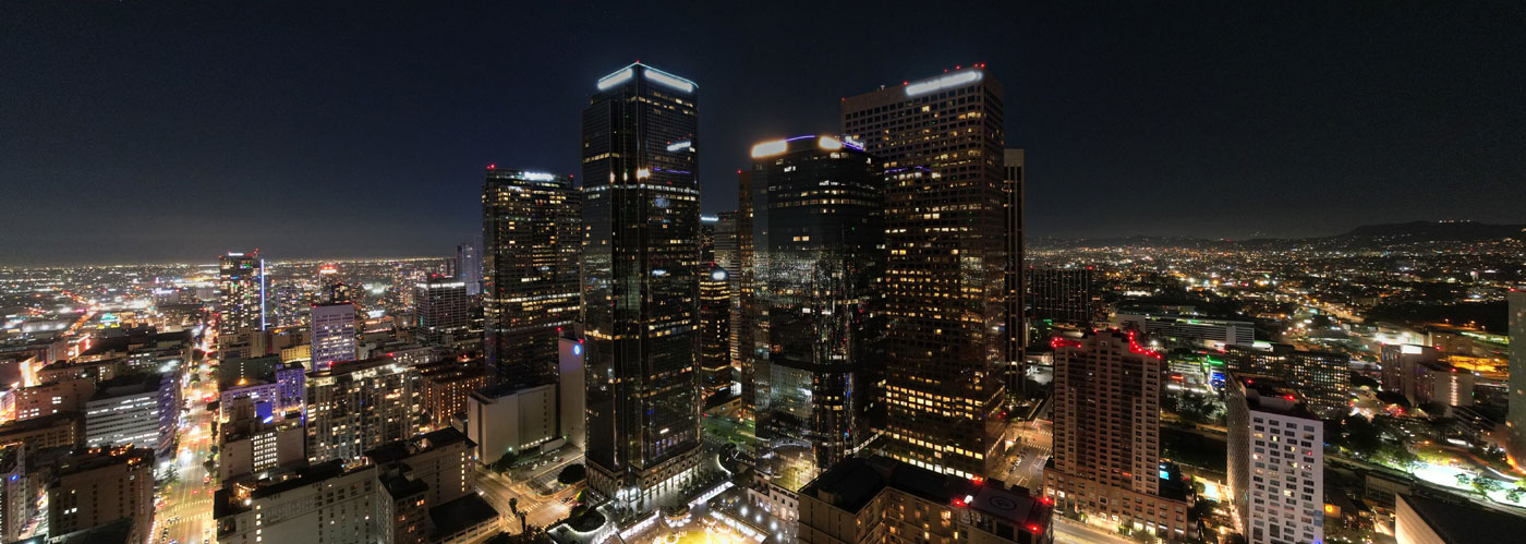 aerial panoramic view of high buildings at night