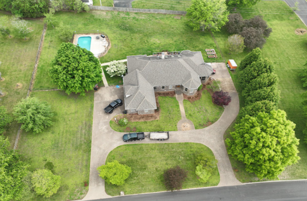 Aerial view of home with prroperty