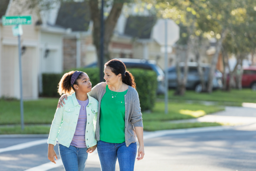 Mother and daughter walking together