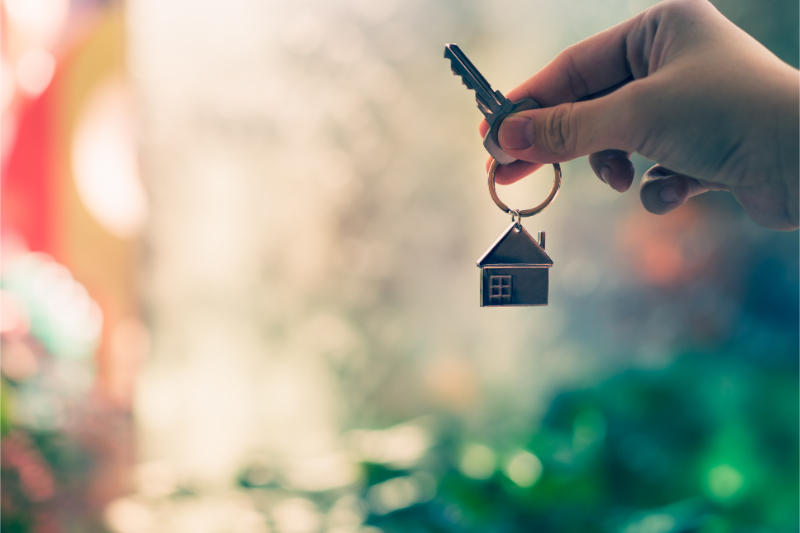 holding house key