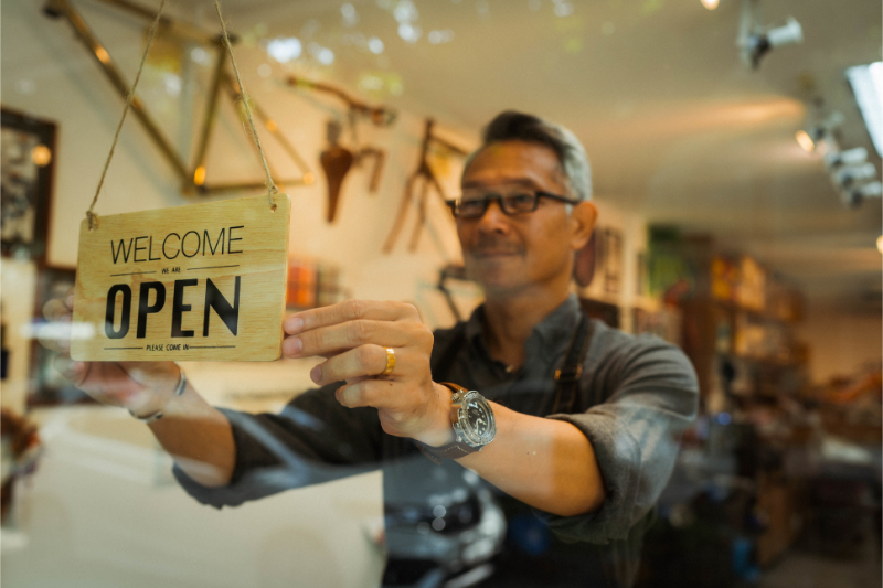 man opening his shop