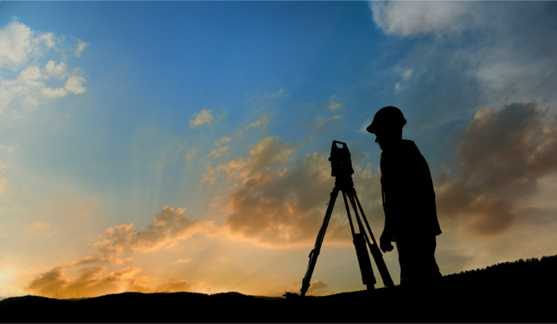measuring land on sunset
