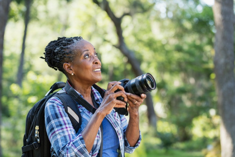 woman hiking with camera