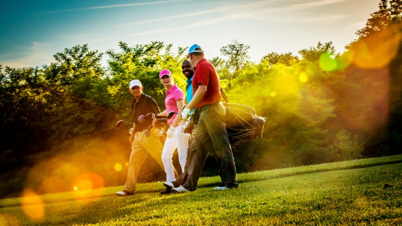 friends playing golf