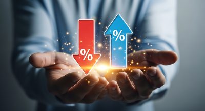 Hands holding up and down arrows with percentage signs symbolizing financial change finance