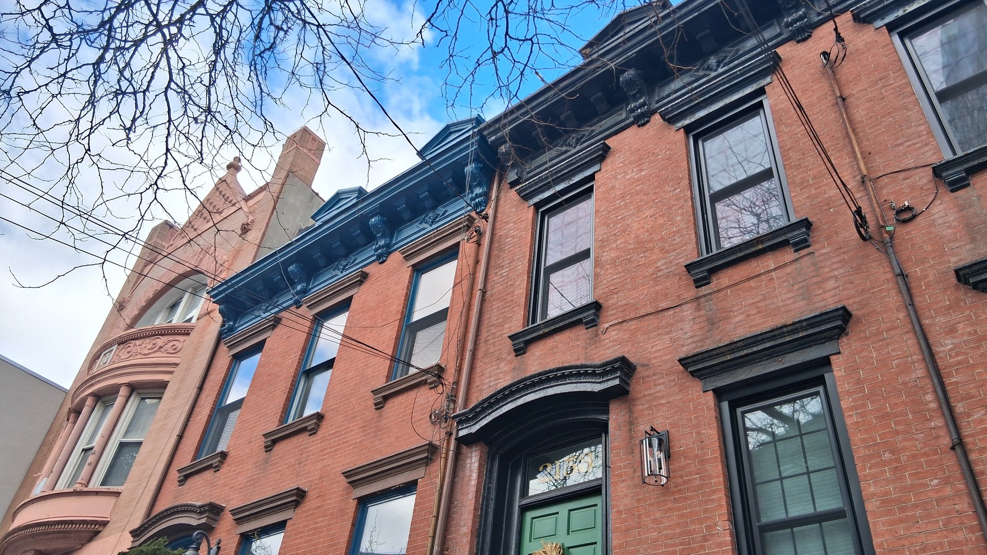 Historic brick row houses in Long Island City, Queens, New York — homes bought with typical Queens NY buyer closing costs