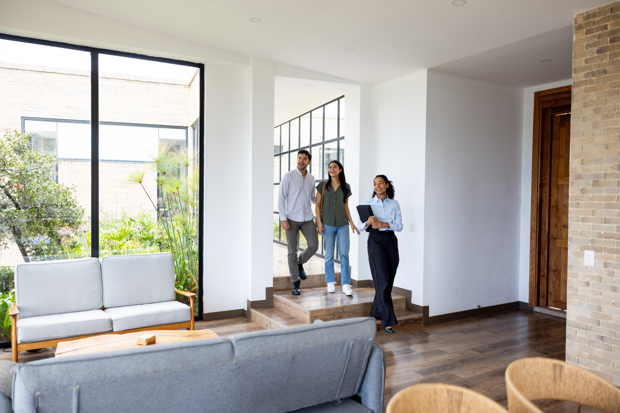 Homebuyers touring a home with a real estate agent