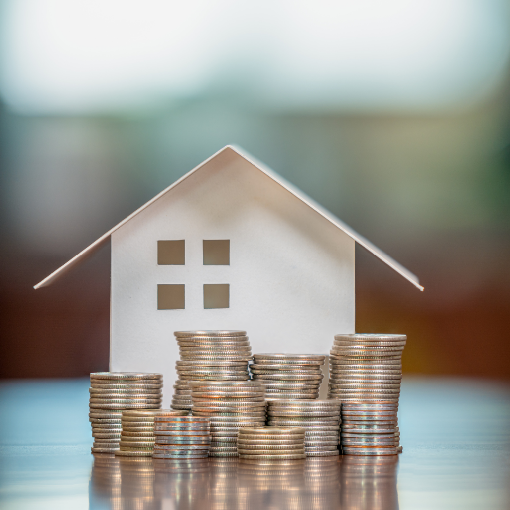 Home with cents stacked up. Equity.