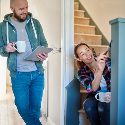 Two people working on a fixer upper home