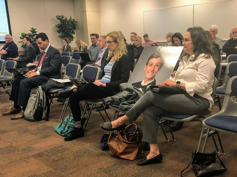 Anna brings Alexei's photo along.