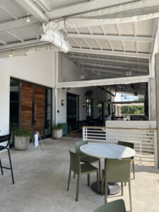 Tables with chairs on Hank's outdoor patio in Northeast Austin!